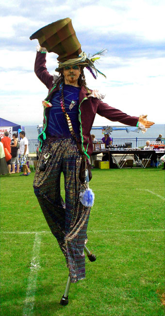 Stilt walking mad hatter